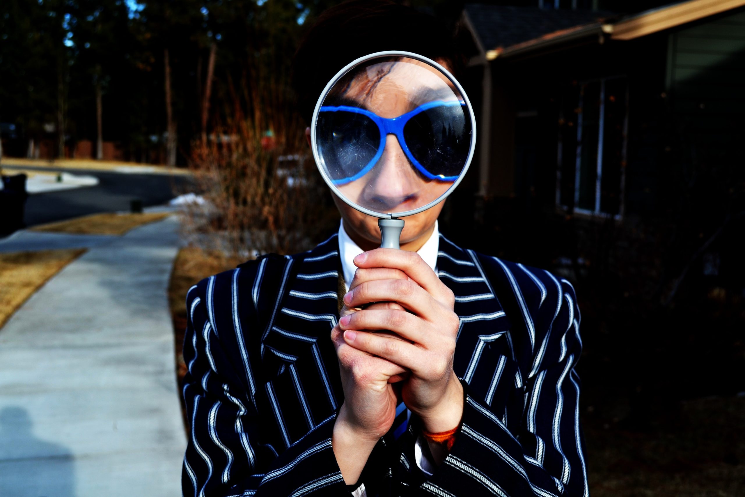 person holding a magnifying glass